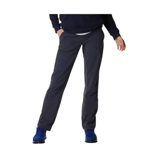 Dark gray women’s hiking pants shown on a model with hands in pockets