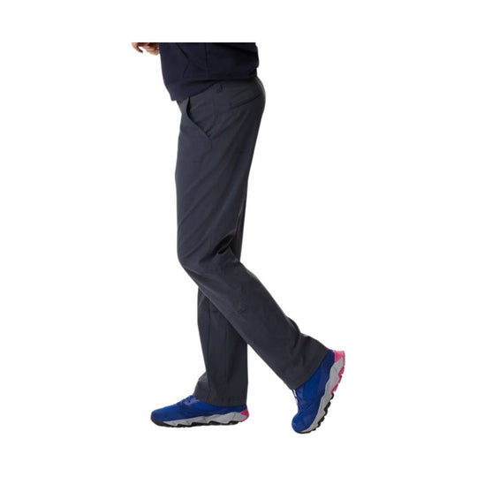 Dark gray women's hiking pants shown in side view, with a slim straight-leg fit and blue athletic shoes visible