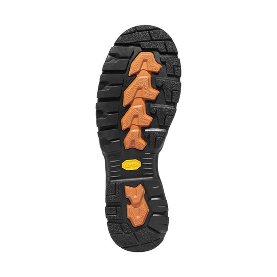 Black lugged boot outsole with orange traction inserts and a yellow Vibram logo