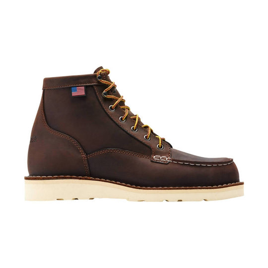 Brown leather lace-up work boot with cream sole and small American flag tag