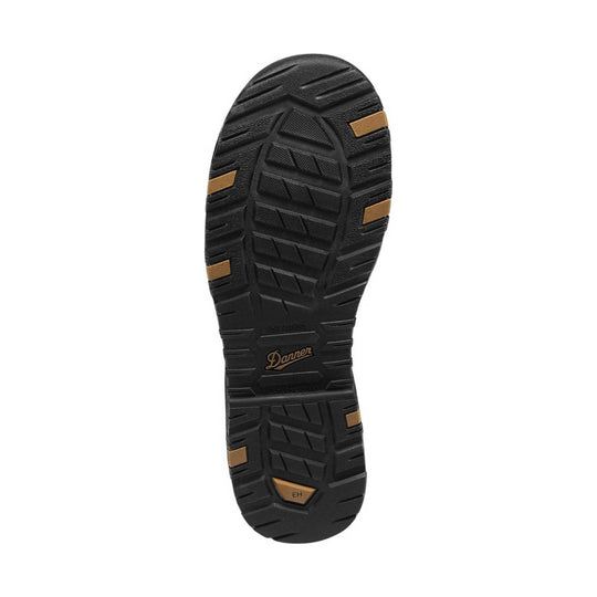 Black boot outsole with tan traction inserts and Danner logo