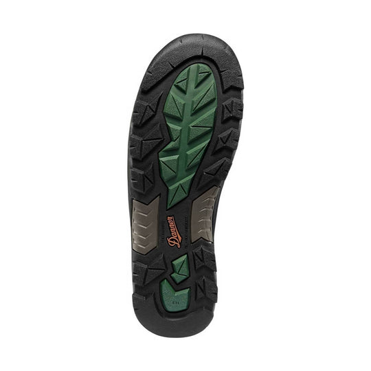 Black lugged boot outsole with green traction inserts and Danner branding