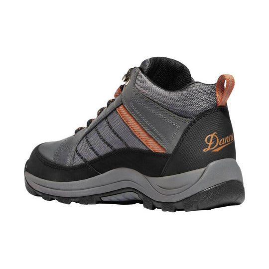 Gray and black mid-top hiking boot with orange accents and a logo on the heel