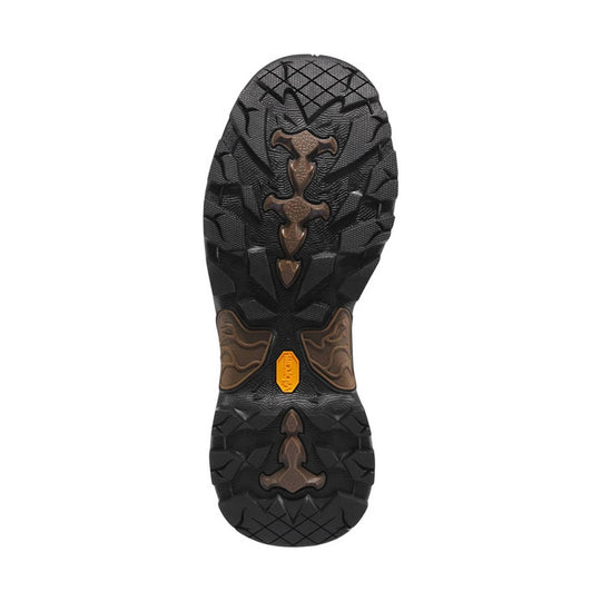 Black and brown lugged boot outsole with a yellow badge at the heel