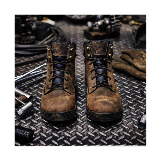 Brown leather lace-up work boots with black toe caps and side rivet details