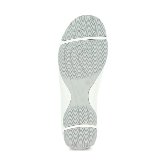 Light gray sneaker sole with wavy tread patterns and molded grooves
