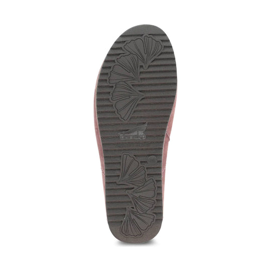 Brown shoe outsole with ribbed tread and floral leaf pattern