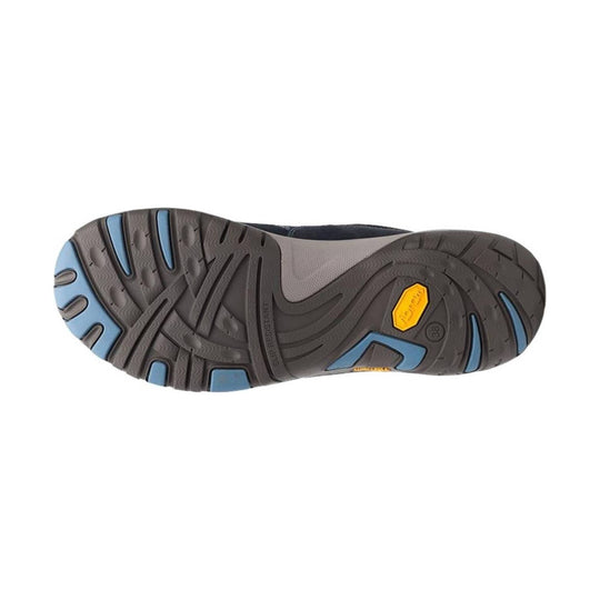 Traction outsole of a dark gray hiking sneaker with blue tread accents and a yellow heel badge