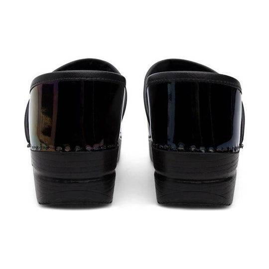 Pair of black patent leather wedge clogs shown from the back