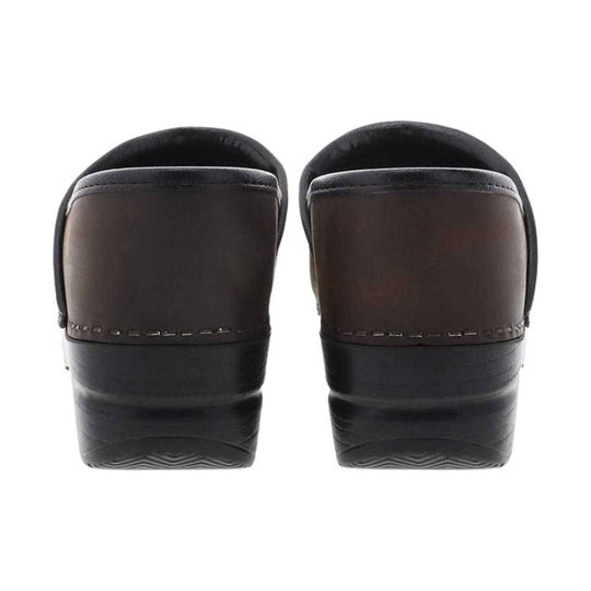 Back view of dark brown and black slip-on clogs with thick wedge soles