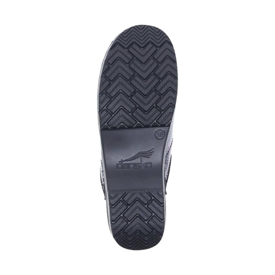Black shoe outsole with herringbone tread, Dansko logo, and size 38 marking