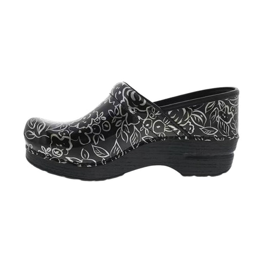 Black floral clogs with a glossy upper and chunky woodgrain platform heel