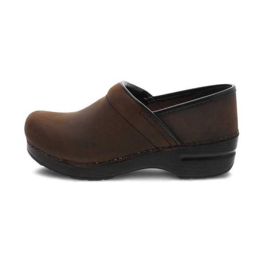 Brown leather clog with a closed toe and black rocker sole