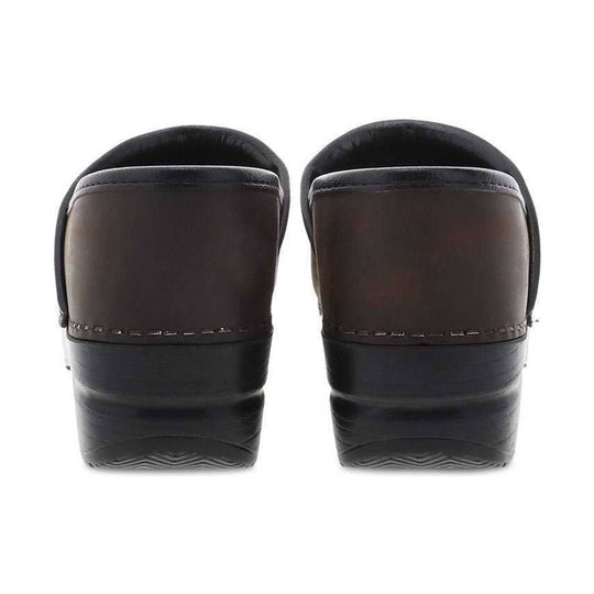 Pair of brown clogs shown from the back with black cushioned soles