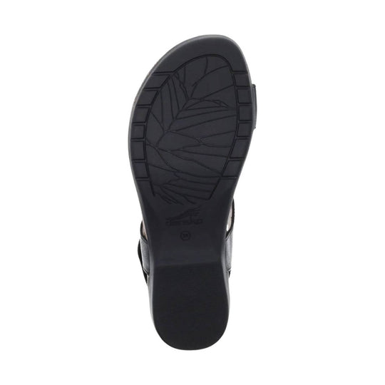 Black sandal sole with tread pattern, shown from the bottom