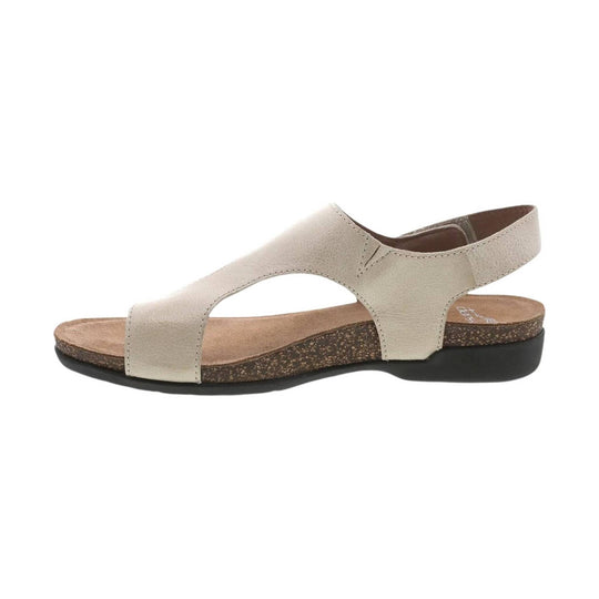 Beige leather open-toe sandal with a cork midsole and black outsole, side view