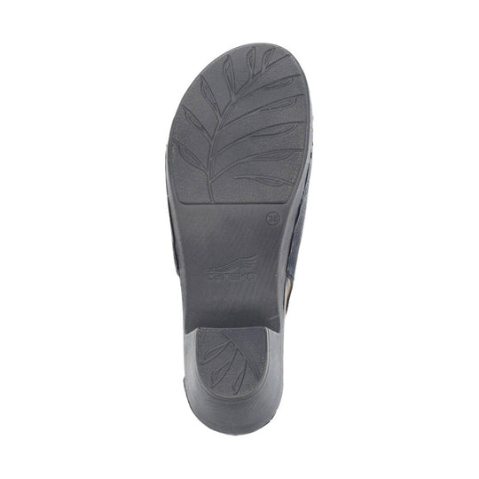 Gray shoe sole with leaf-pattern tread and Dansko logo