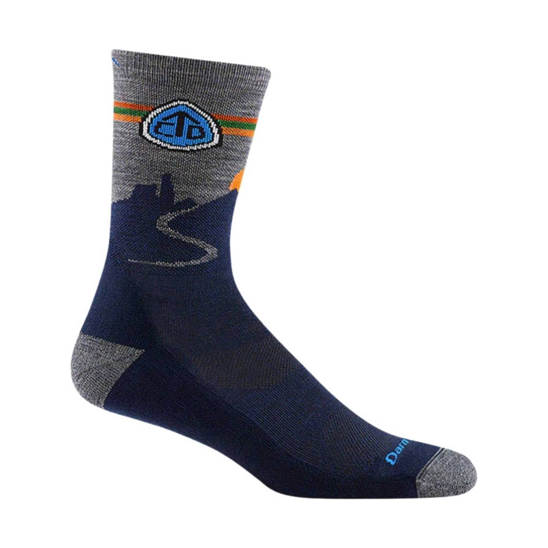 Gray and navy crew hiking sock with blue logo, orange and green stripes, and reinforced toe and heel