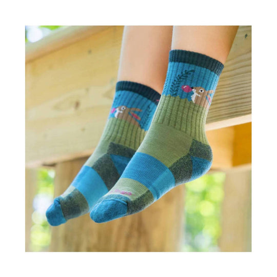 Pair of blue and green kids' crew socks with bunny illustrations
