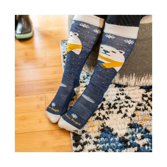 Blue knee-high socks with polar bear graphics and snowflake patterns
