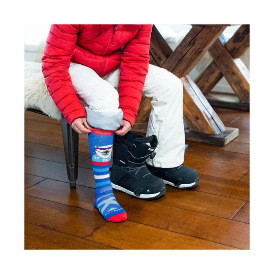 Blue knee-high ski sock with a polar bear graphic, stripes, and red toe and cuff