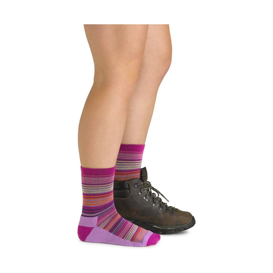 Striped magenta and purple crew socks with pink toe and heel, worn with brown hiking boots