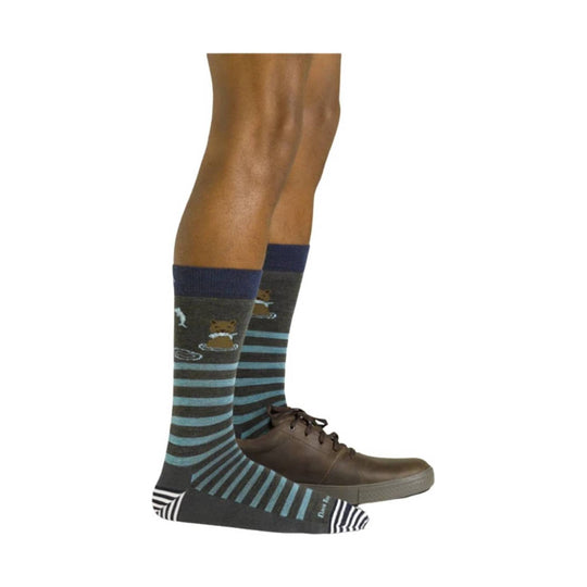 Pair of dark striped knee-high socks with teal and navy bands, worn with brown dress shoes