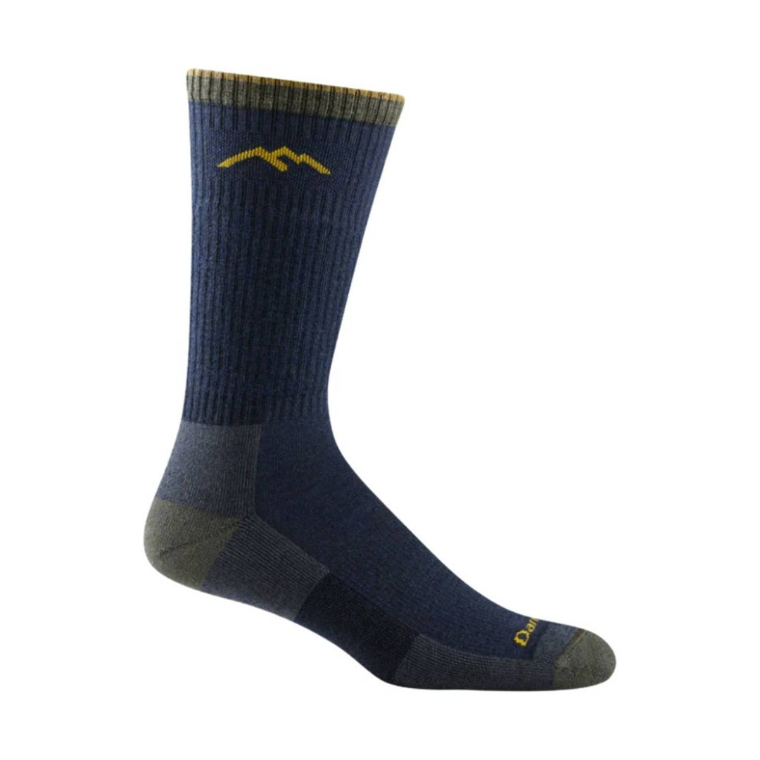 Tall navy hiking sock with gray toe, heel, and cuff, plus a small yellow logo near the top.