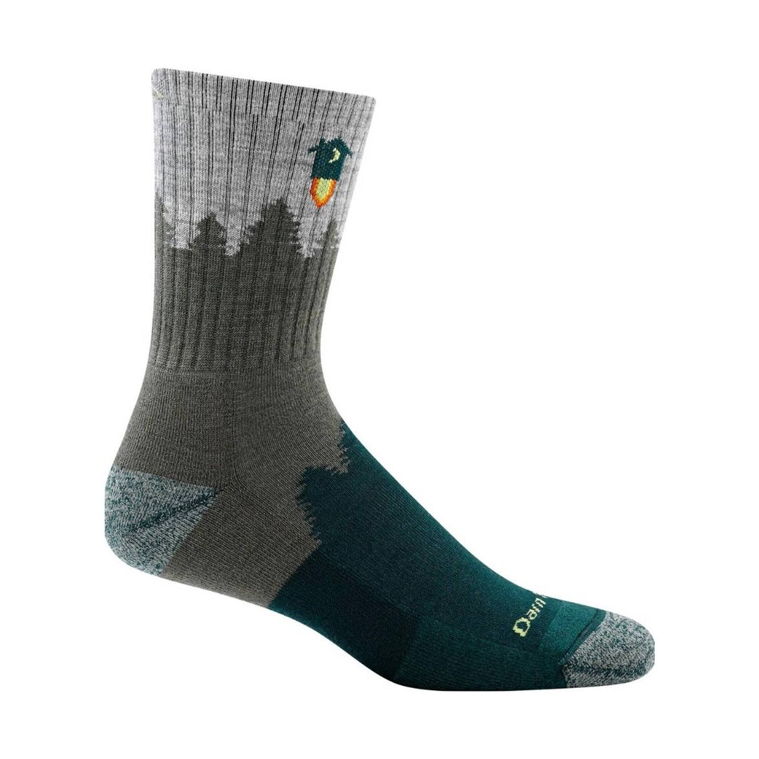 Gray and teal mid-calf hiking sock with tree silhouettes and a small campfire graphic