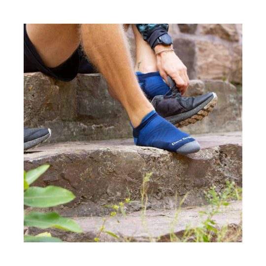 Blue ankle running sock with a gray toe and visible Darn Tough branding