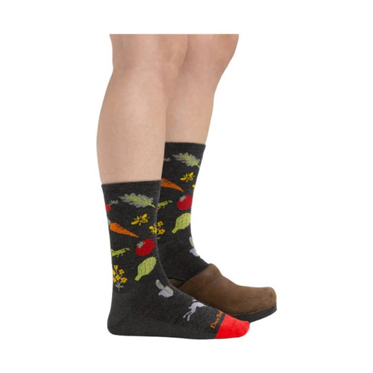 Charcoal crew socks with colorful farm produce pattern, worn with brown clogs
