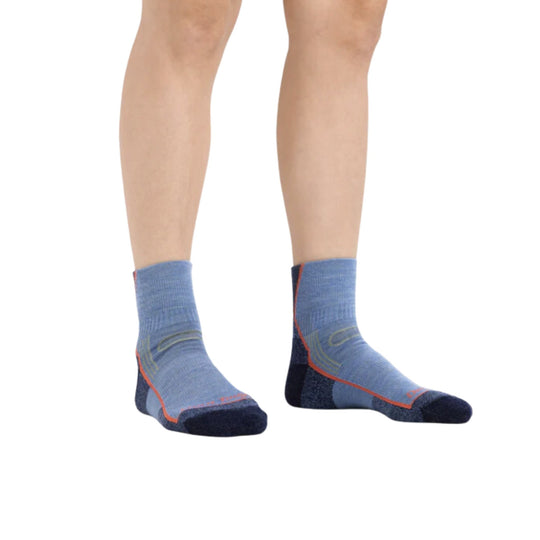 Pair of blue ankle hiking socks with orange trim and dark toe and heel panels