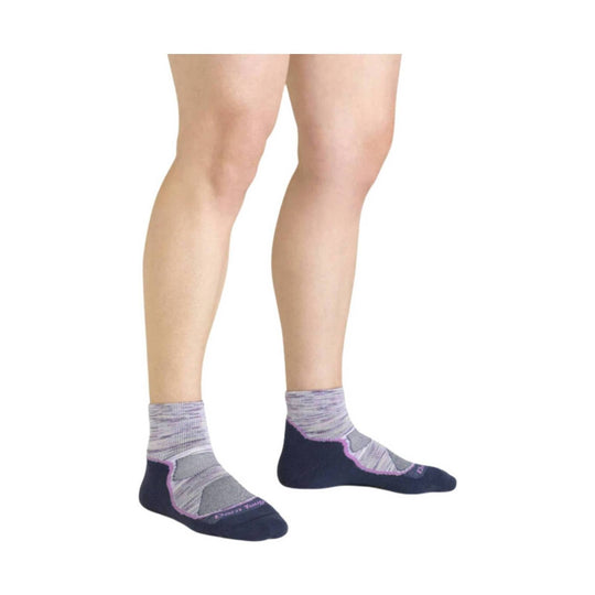 Low-cut hiking socks in navy, gray, and purple on a model's lower legs
