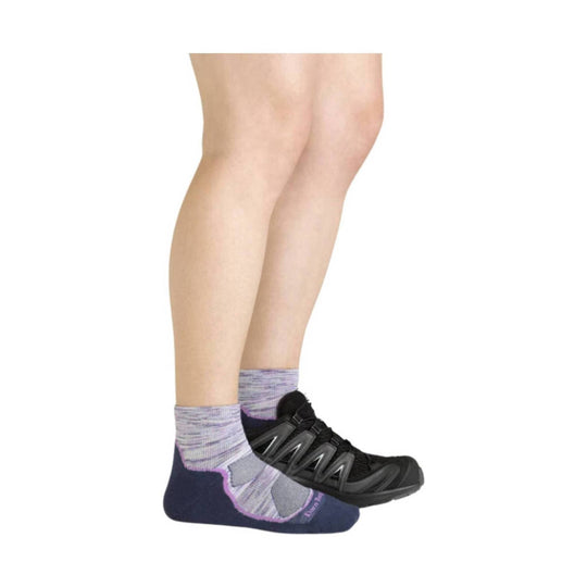 Low-cut hiking socks with black trail shoes on a model’s lower legs