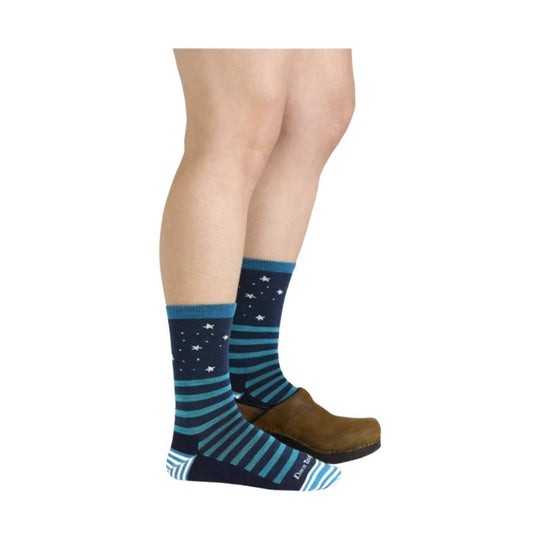 Navy crew socks with teal stripes and star pattern, shown with brown clogs
