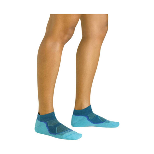 Light blue no-show athletic socks on a model's feet