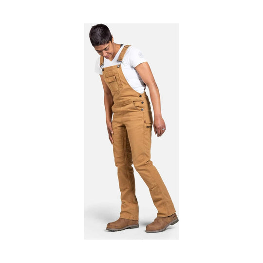 Tan bib overalls with side button closure, front chest pocket, and work boots over a white T-shirt