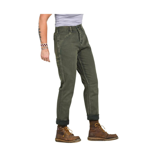 Cropped view of olive green work pants with rolled cuffs and brown lace-up boots
