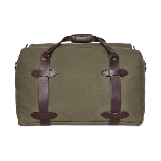 Olive canvas duffel bag with brown leather straps and top handle