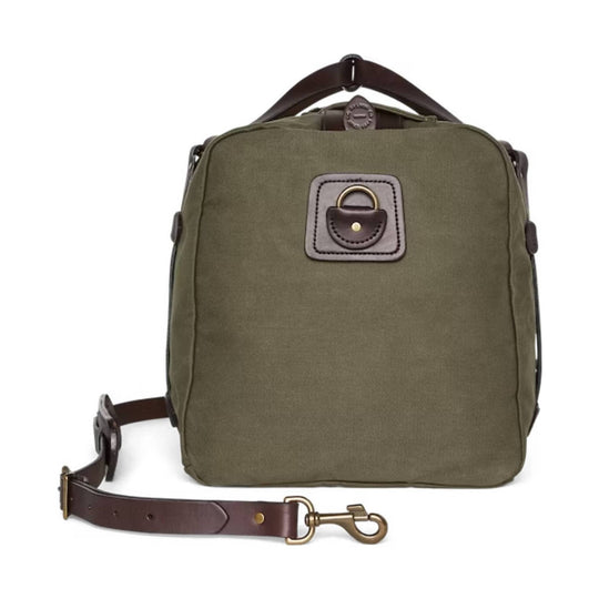 Olive canvas duffel bag with leather handles, detachable shoulder strap, and front lock patch