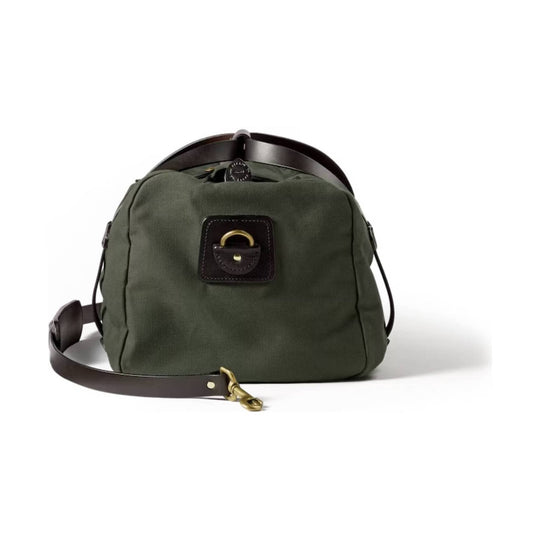 Olive canvas duffle bag with dark leather trim, top handles, and a detachable shoulder strap