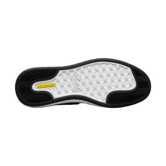 Black-and-white sneaker outsole with textured rubber tread and a yellow COMFORTECH insert