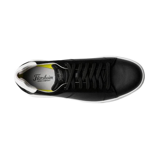 Black low-top sneaker with laces and white sole, top view