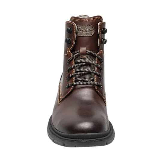 Brown leather lace-up ankle boot with stitched panels, metal eyelets, and a black rubber sole