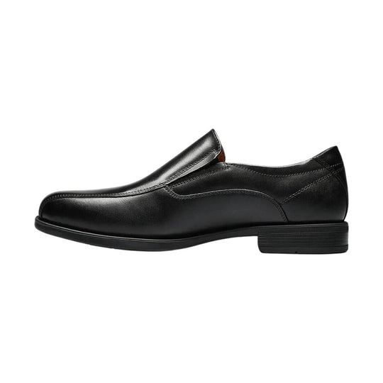 Black leather slip-on dress shoe shown in side profile