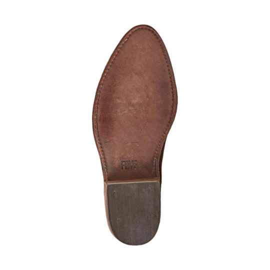 Brown leather boot sole with a rubber heel and FRYE stamp
