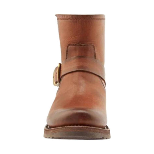 Brown leather ankle boot with a strap and brass buckle, front view