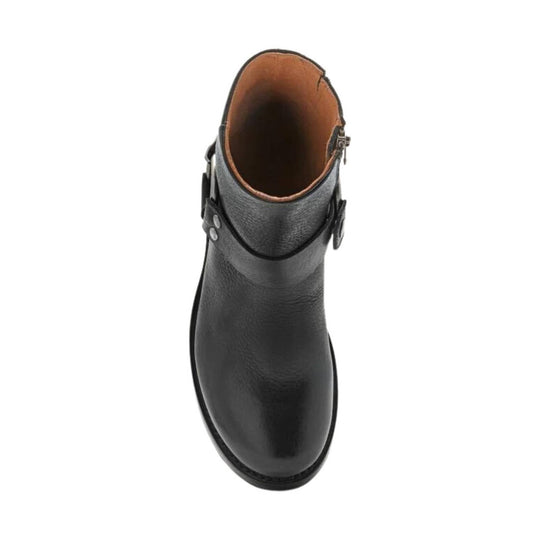 Black leather ankle boot with side harness straps and a side zipper, viewed from above