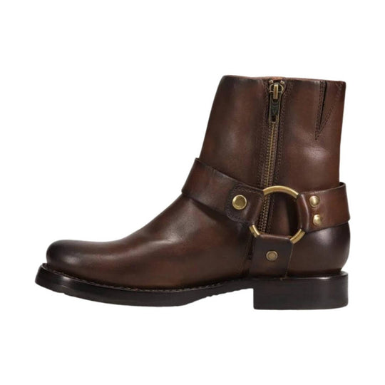 Brown leather ankle boot with side zipper, brass ring strap detail, and low heel