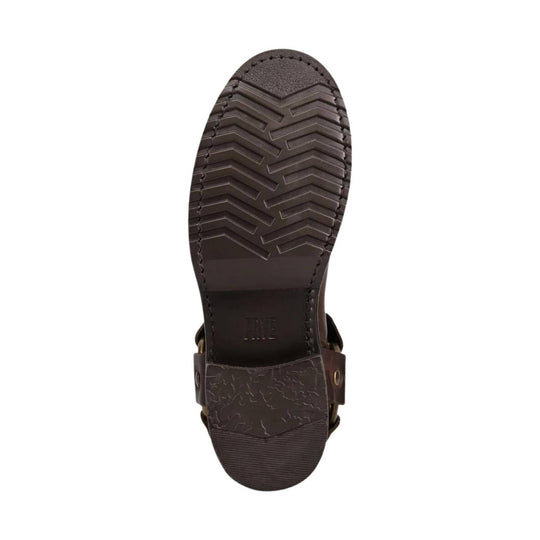 Dark brown boot sole with zigzag tread and embossed FRYE logo